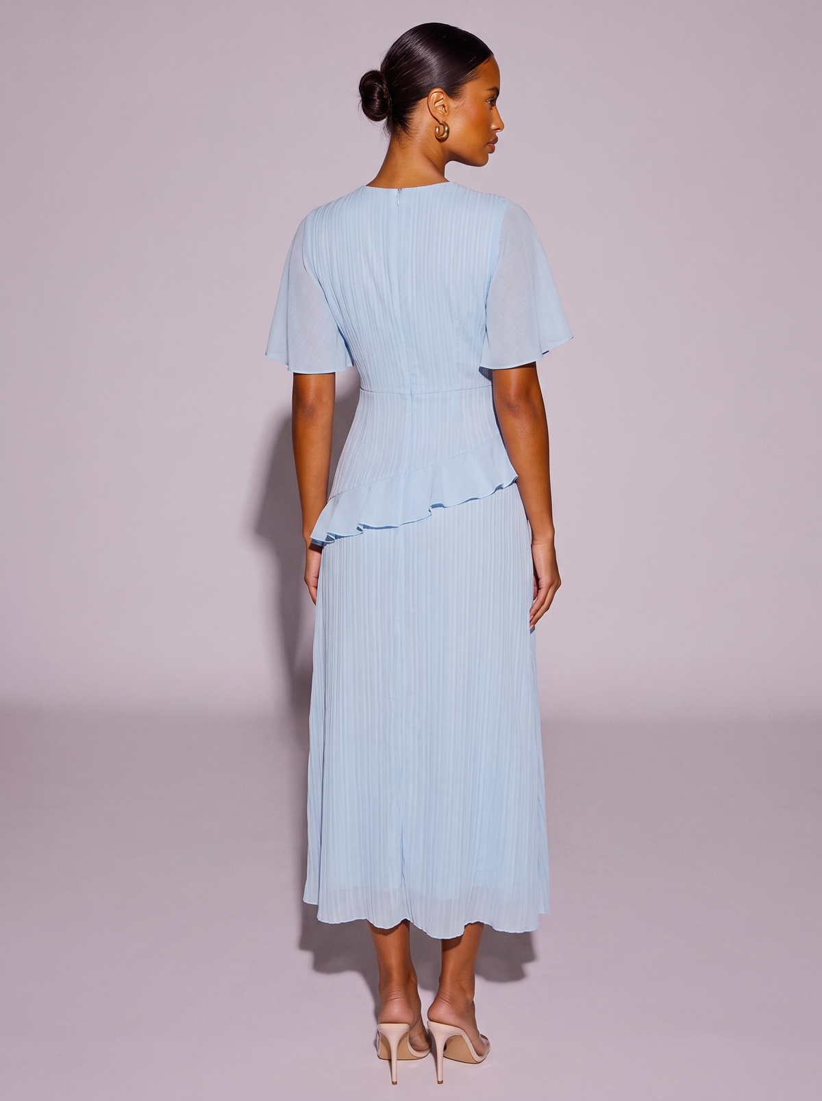 Amsterdam Ruffled Flutter Sleeve Dress in Light Blue — back view